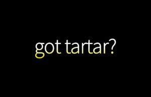 Text on black background: Got Tartar?